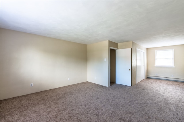 unfurnished bedroom featuring a baseboard heating unit and carpet floors