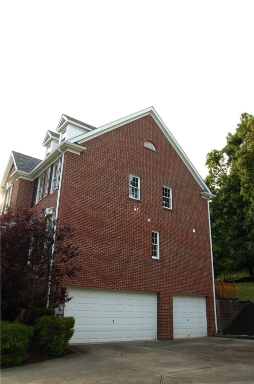 view of side of home with a garage