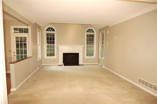 unfurnished living room with crown molding and light carpet