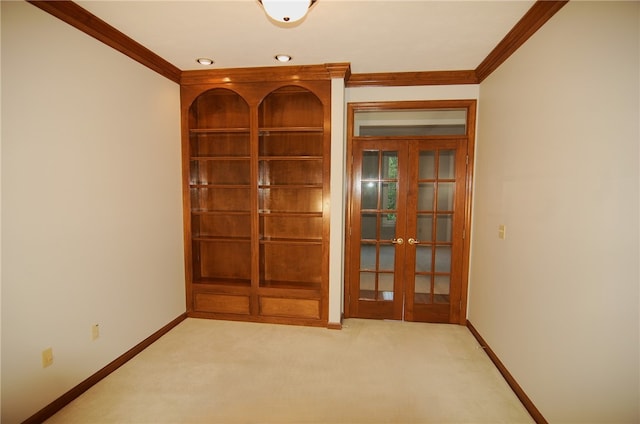 interior space featuring ornamental molding, light carpet, and french doors