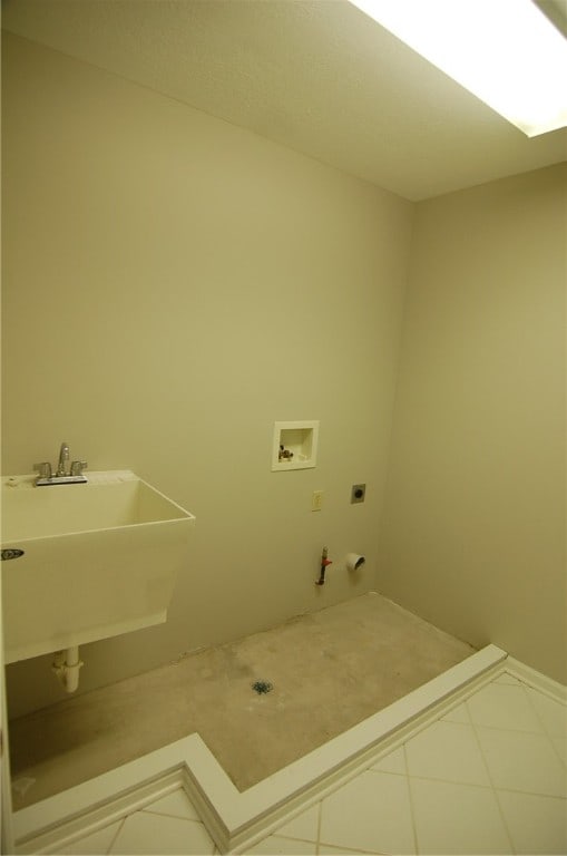 laundry room featuring washer hookup, tile patterned flooring, electric dryer hookup, gas dryer hookup, and sink