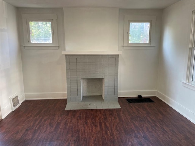 623 Beaver St, Ambridge, PA 15003 - unfurnished living room featuring baseboards, a fireplace, and wood finished floors