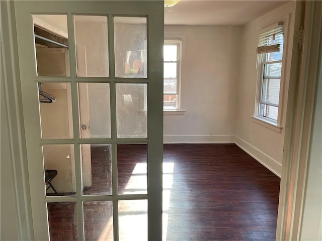 623 Beaver St, Ambridge, PA 15003 - unfurnished room with healthy amount of natural light, dark wood-type flooring, and baseboards