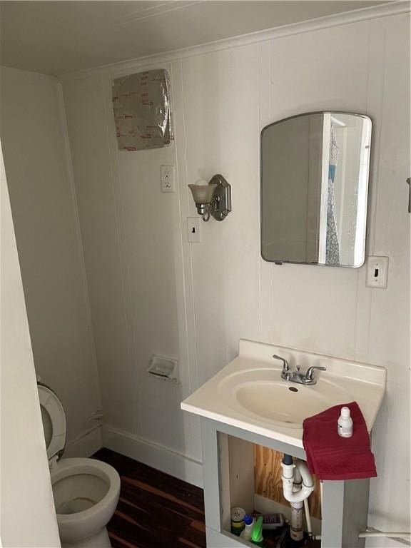 623 Beaver St, Ambridge, PA 15003 - bathroom with wood finished floors and toilet