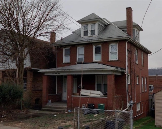 623 Beaver St, Ambridge, PA 15003 - traditional style home featuring a porch, brick siding, and a chimney