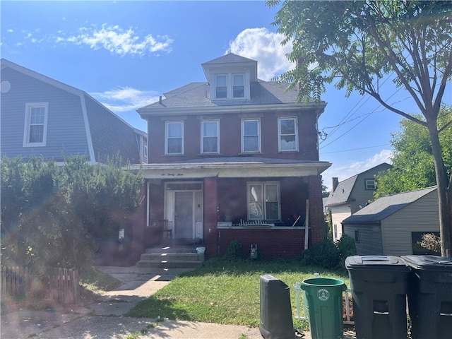 view of front of property featuring a porch and a front lawn