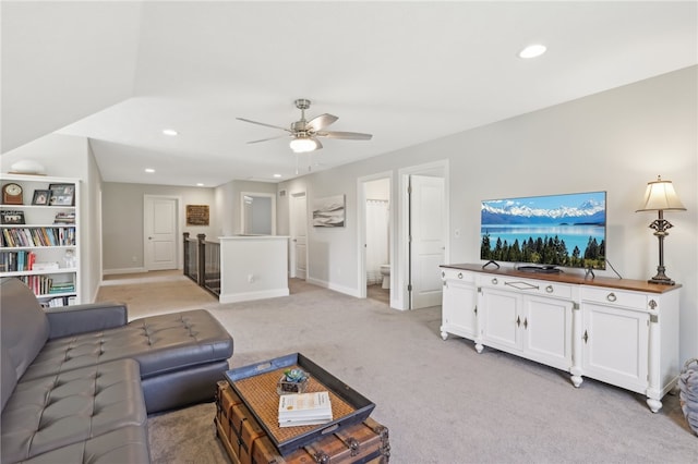 living room featuring light carpet and ceiling fan