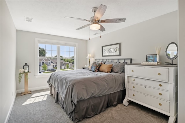 carpeted bedroom featuring ceiling fan