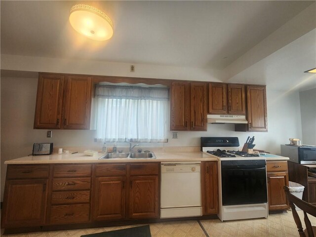 kitchen with white appliances and sink