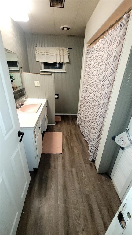 bathroom featuring vanity and hardwood / wood-style floors