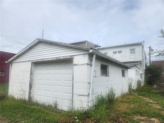 view of side of property with a garage