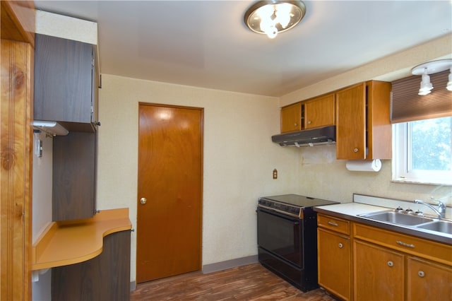 kitchen with dark wood-type flooring, sink, and black range with electric cooktop