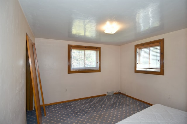 unfurnished bedroom with carpet