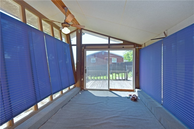 unfurnished sunroom featuring ceiling fan