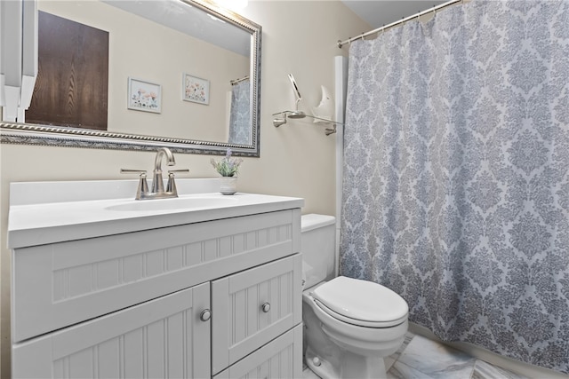 bathroom with vanity, toilet, a shower with shower curtain, and tile patterned flooring