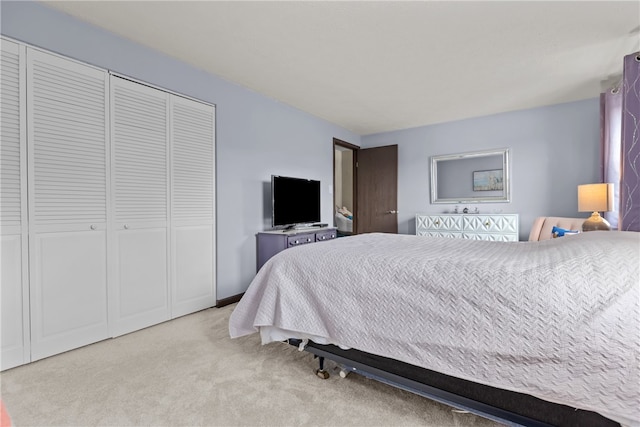 carpeted bedroom with a closet