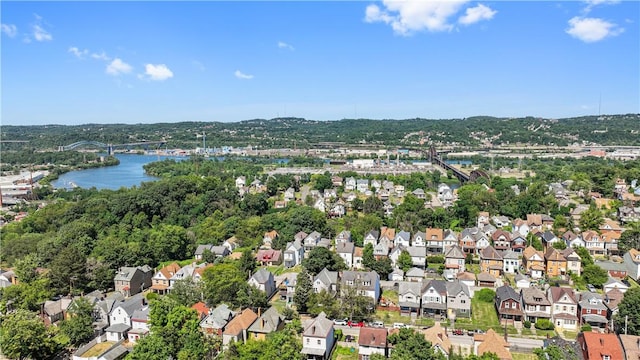 drone / aerial view with a water view and a residential view