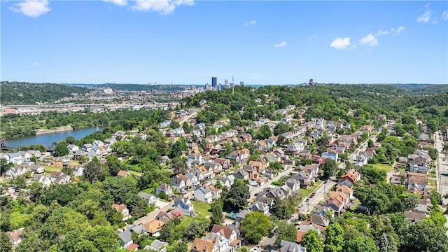 birds eye view of property with a residential view and a water view