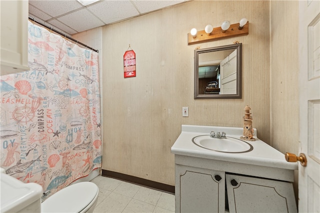 full bathroom with toilet, vanity, a drop ceiling, and a shower with shower curtain