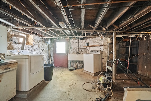 basement featuring washing machine and clothes dryer