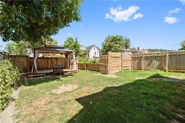 view of yard with a fenced backyard and a gazebo