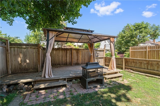 exterior space with a yard, a fenced backyard, and a gazebo