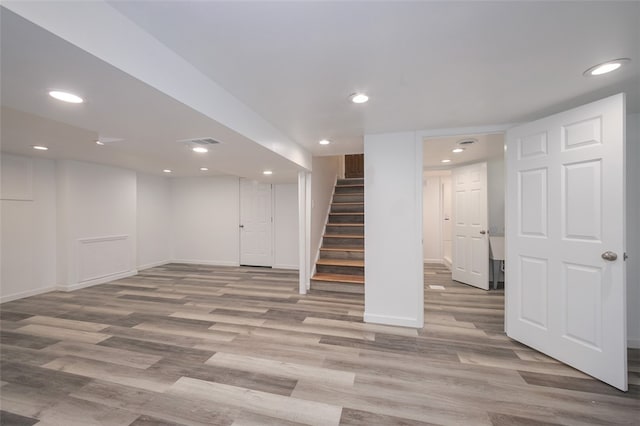 basement featuring light wood-type flooring