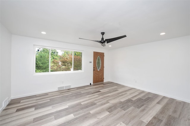 unfurnished room featuring ceiling fan and light hardwood / wood-style flooring