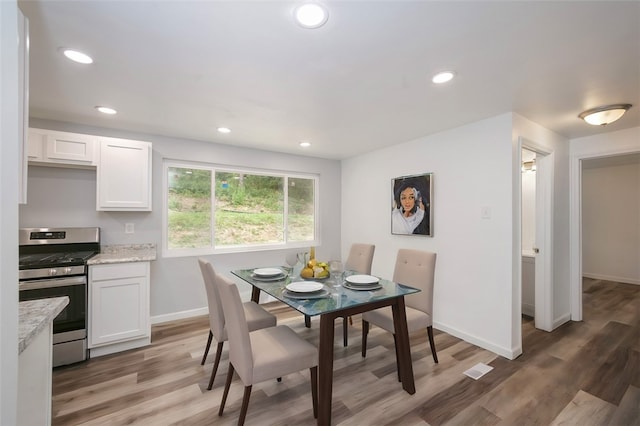 dining room featuring hardwood / wood-style flooring