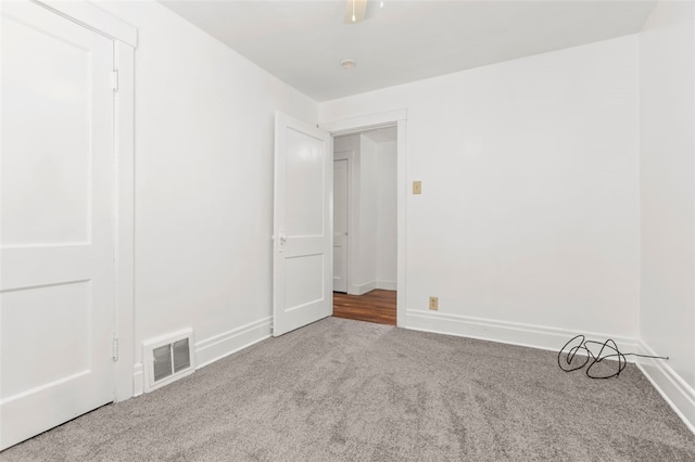 empty room with carpet flooring