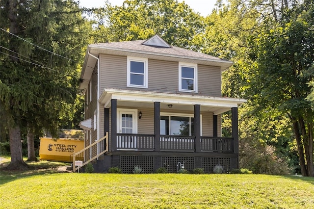 view of front of home featuring covered porch and a front lawn