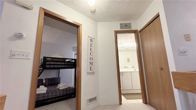 hallway featuring light tile patterned flooring