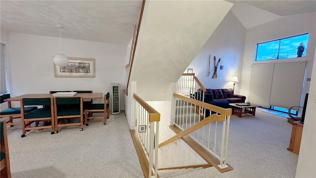 home office with carpet and vaulted ceiling