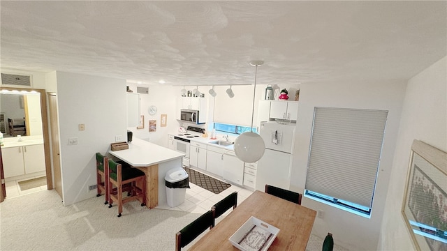 interior space featuring sink and light tile patterned flooring