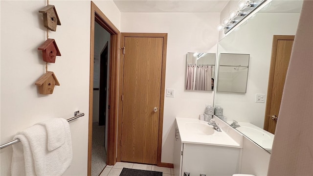 bathroom featuring vanity and tile patterned flooring