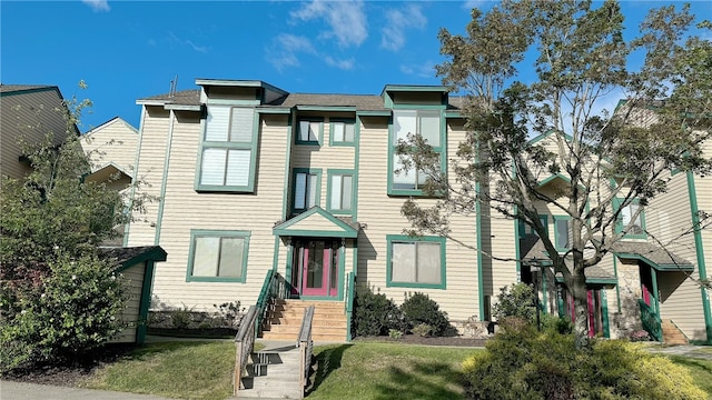 view of property featuring a front yard