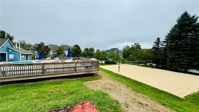 view of yard with volleyball court and a fenced in pool