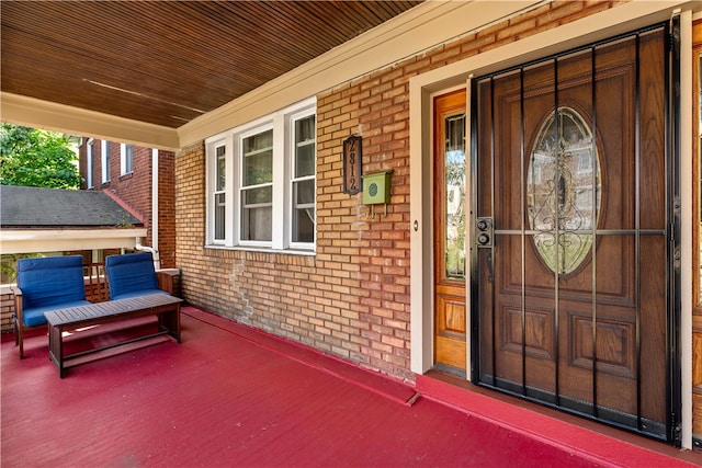 doorway to property featuring a porch