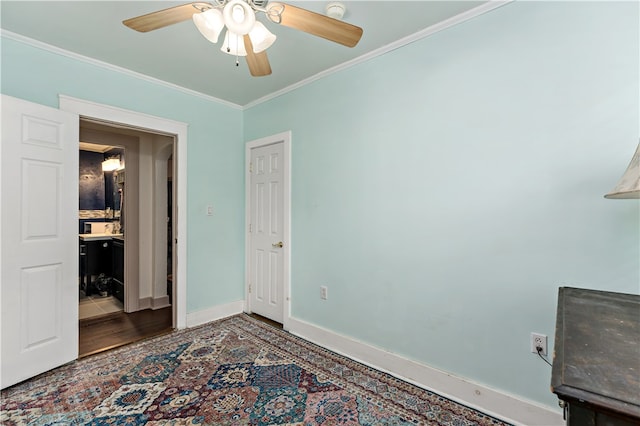 unfurnished bedroom with ceiling fan, hardwood / wood-style floors, and ornamental molding