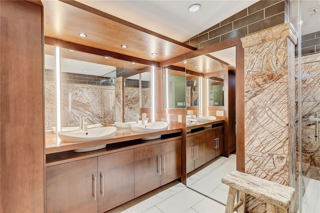 bathroom featuring tile walls, vanity, and tile patterned flooring