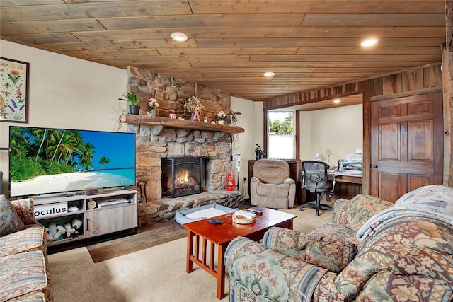 living room with wood walls, light colored carpet, wooden ceiling, and a fireplace