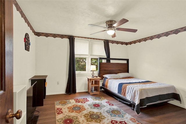 bedroom with hardwood / wood-style flooring and ceiling fan