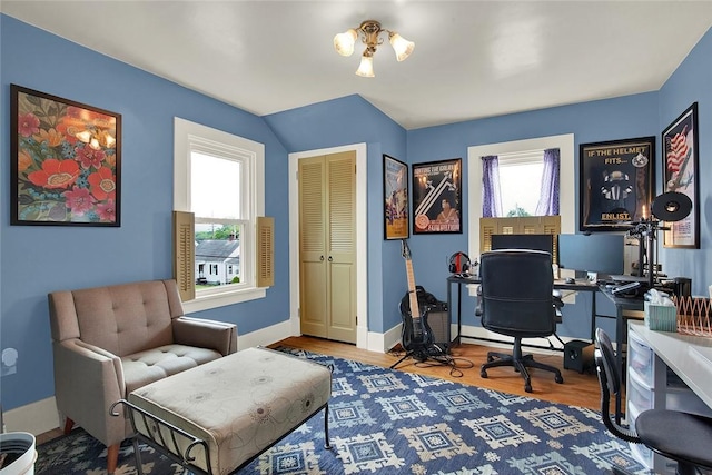 home office with hardwood / wood-style floors