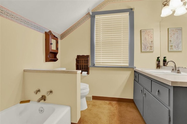 bathroom featuring a tub, crown molding, vanity, and toilet