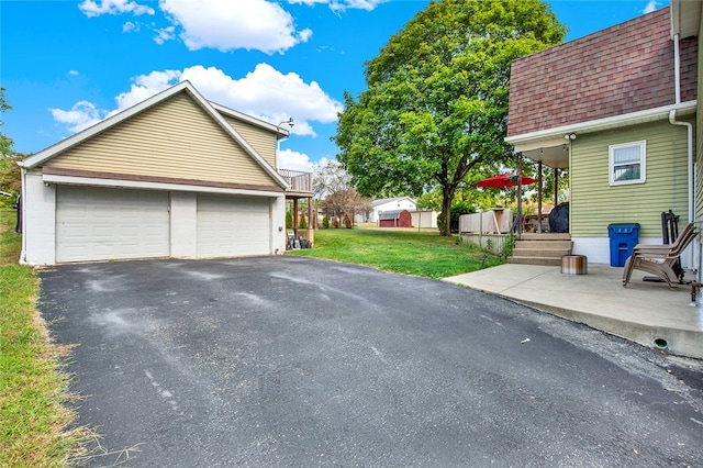 garage featuring a yard