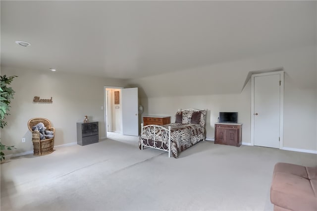 carpeted bedroom featuring lofted ceiling