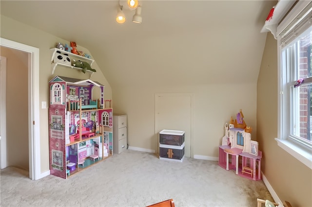 playroom with vaulted ceiling and carpet floors