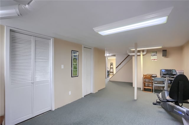 workout room featuring carpet floors