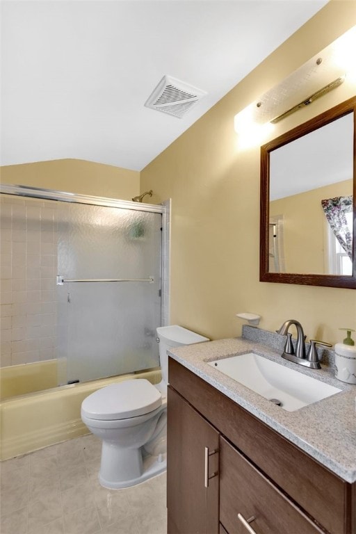 full bathroom featuring toilet, combined bath / shower with glass door, and vanity