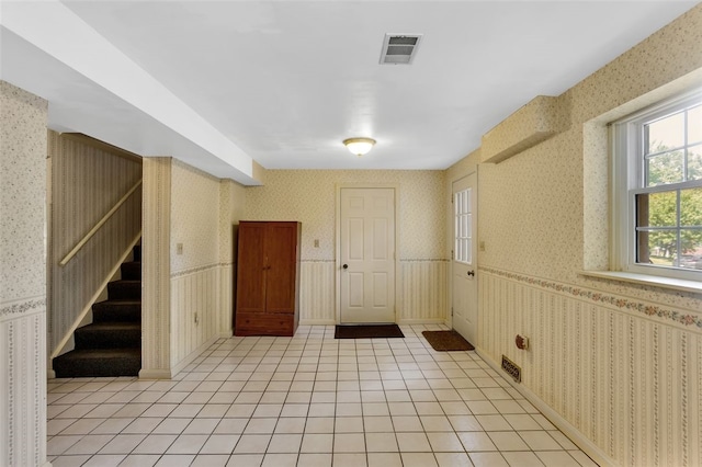 foyer featuring light tile patterned floors